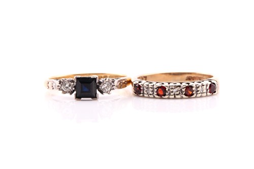 Lot 806 - A sapphire and diamond three stone half hoop...