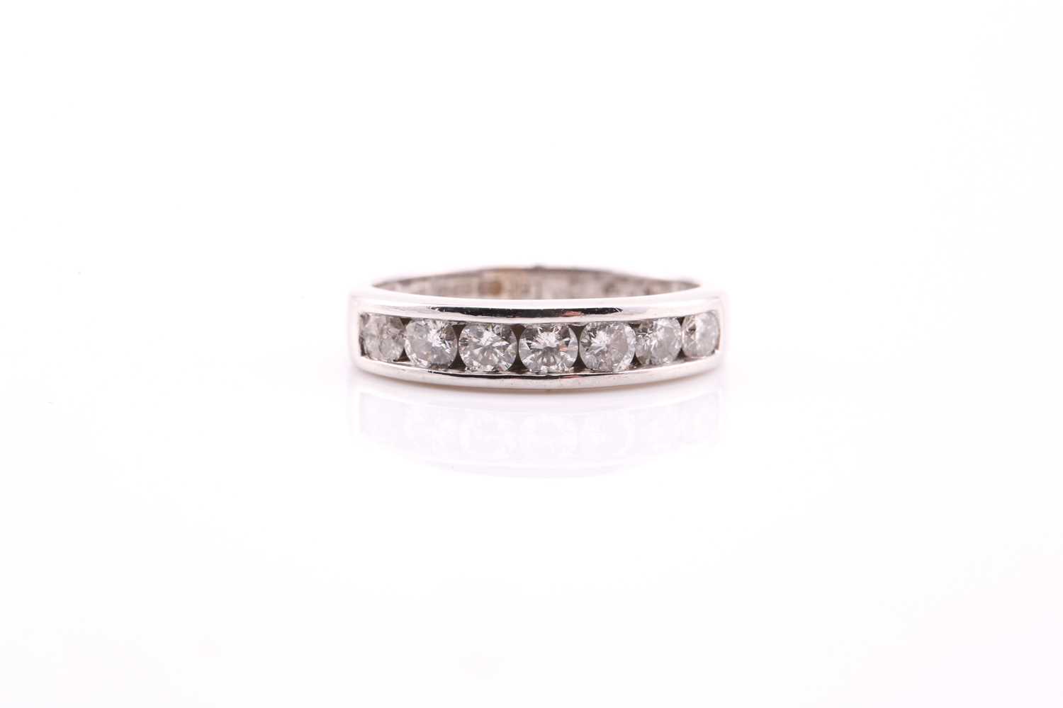 Lot 682 - An 18ct white gold half hoop diamond eternity...