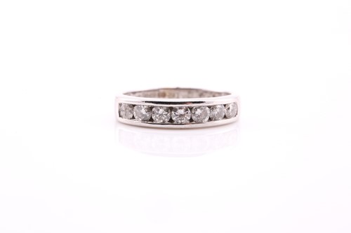 Lot 682 - An 18ct white gold half hoop diamond eternity...