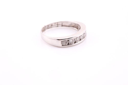 Lot 682 - An 18ct white gold half hoop diamond eternity...