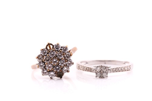 Lot 671 - A diamond cluster ring; the circular pavé set...