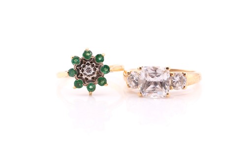 Lot 504 - An emerald and diamond cluster ring; the...