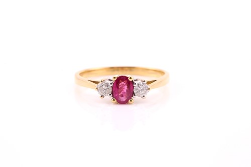 Lot 679 - A three-stone half hoop ruby and diamond ring;...