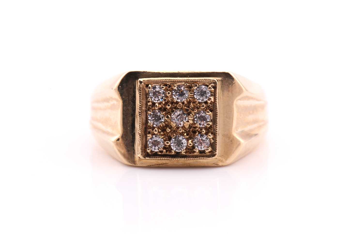 Lot 580 - A square pavé set ring; the nine clear stones...