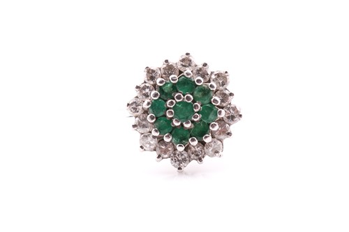 Lot 771 - An emerald and diamond cluster ring;...