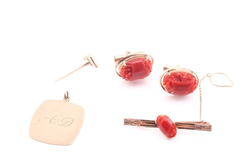 Lot 69 - A pair of red coral cufflinks, to yellow...