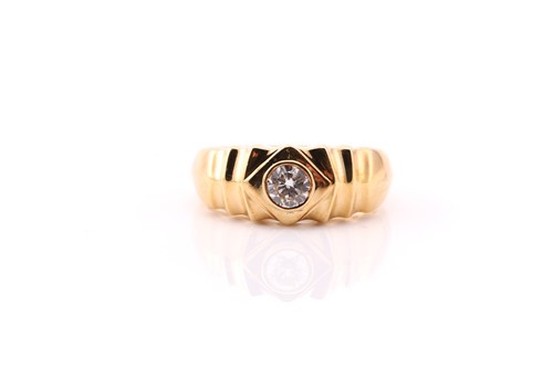 Lot 597 - A single stone diamond ring; the round...