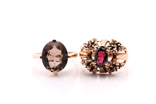 Lot 569 - A 9 single stone smoky quartz ring, in 9 carat...