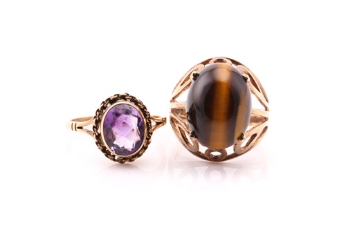 Lot 545 - A single stone tiger's eye ring, in pierced...