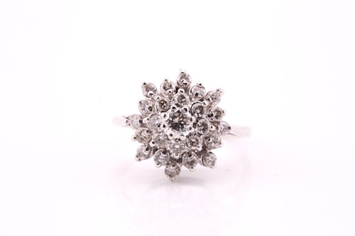 Lot 290 - A three-tier diamond cluster ring, with a...