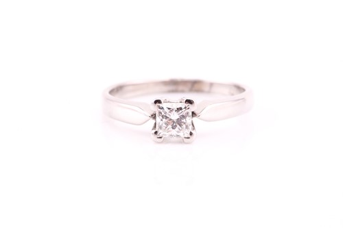 Lot 254 - A single stone diamond ring; the princess cut...