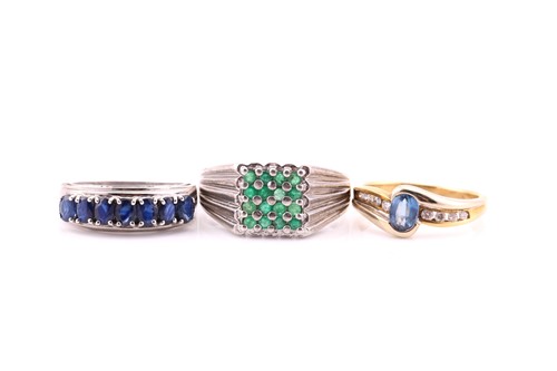 Lot 501 - A sapphire and diamond ring; the oval cut,...