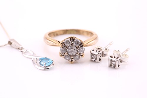 Lot 708 - A seven stone diamond cluster ring, in 9 carat...