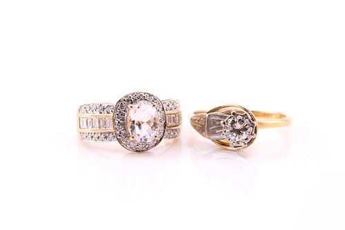 Lot 852 - A single stone diamond ring, in stylised...