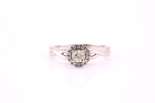 Lot 415 - A diamond cluster ring; the central brilliant...