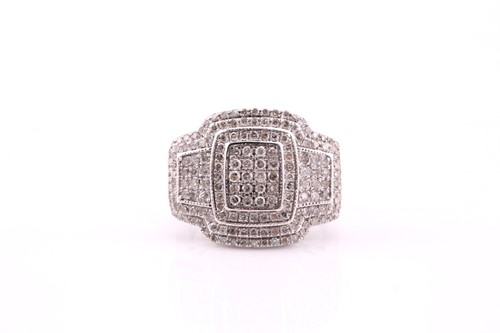 Lot 559 - A diamond cluster ring; the wide,...