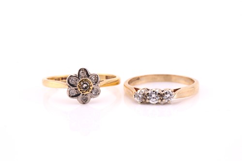 Lot 135 - A diamond cluster ring, the seven stone...