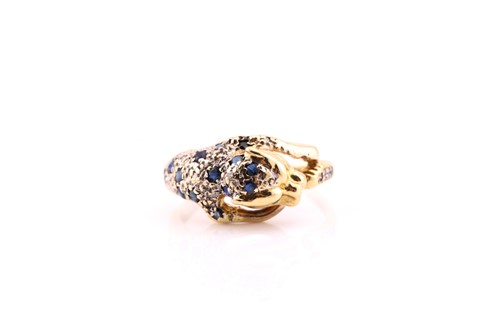 Lot 563 - An 18 carat gold, gem-set panther ring; the...