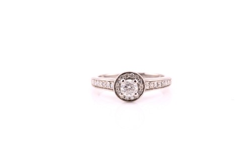 Lot 645 - A diamond cluster ring; the central round...