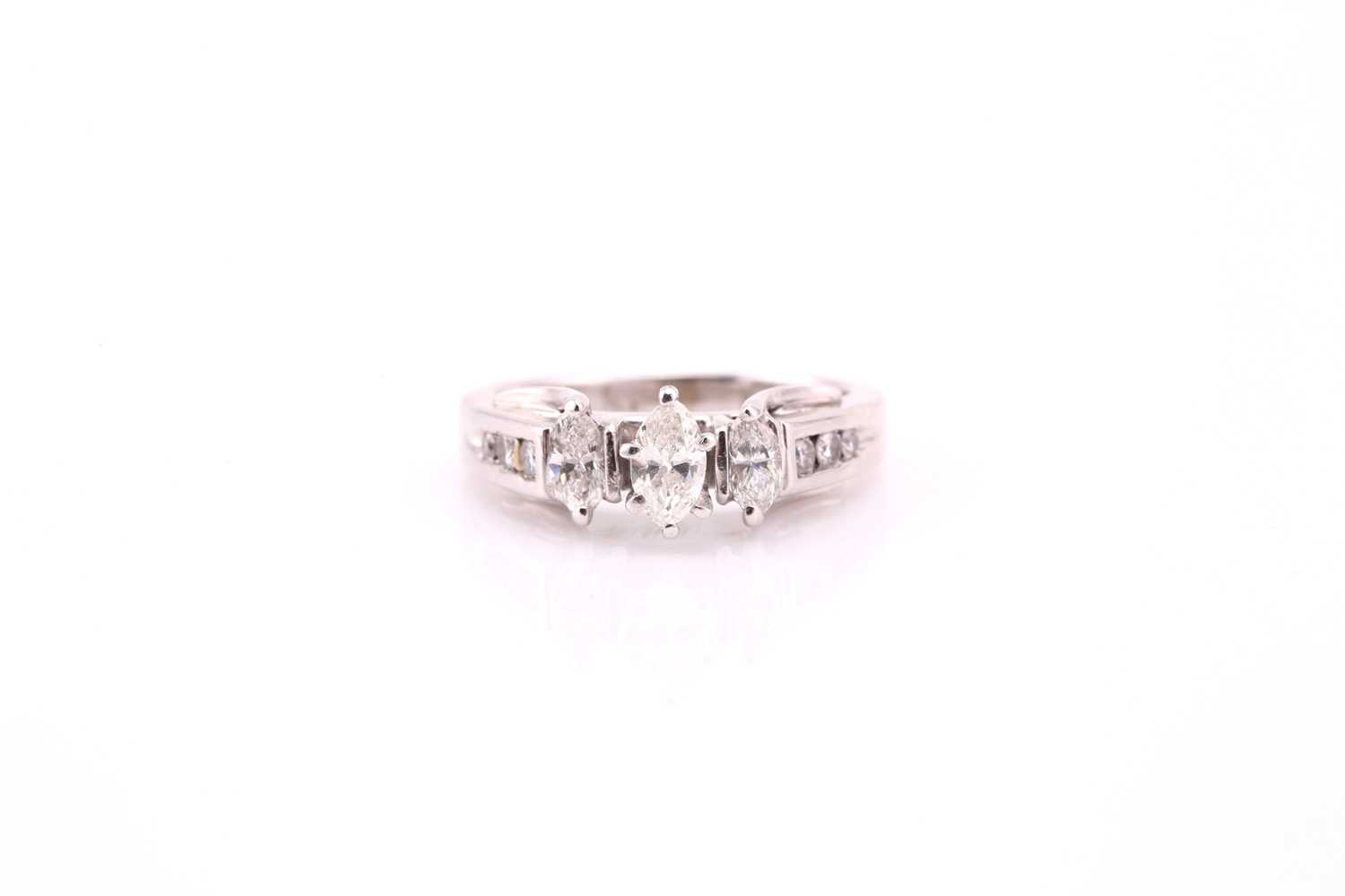 Lot 6 - A thee stone half hoop diamond ring, the...