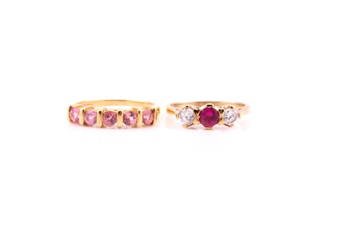 Lot 618 - A five stone half hoop pink sapphire ring; the...