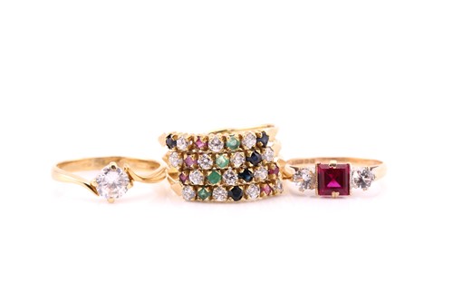 Lot 668 - A 14 carat multi-gem set harem ring. Size N, 4....