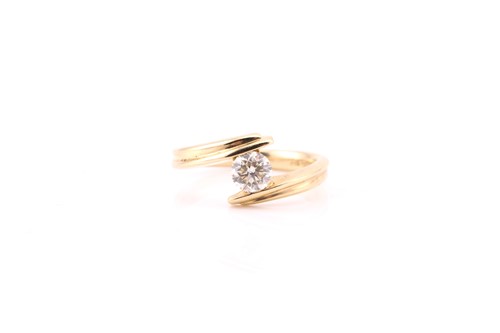 Lot 830 - A single stone diamond ring; the round...