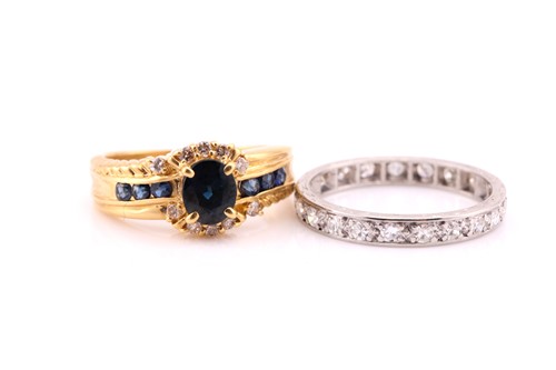 Lot 666 - An oval sapphire and diamond cluster ring;...