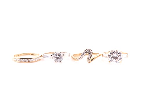 Lot 522 - Four various cubic zirconia rings set in 9 and...