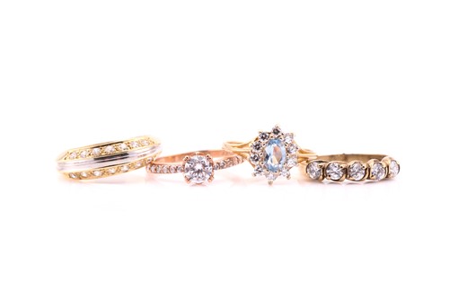 Lot 767 - Four cubic zirconia rings in 9 and 14 carat...