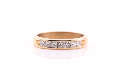 Lot 555 - A seven stone half hoop diamond eternity ring;...