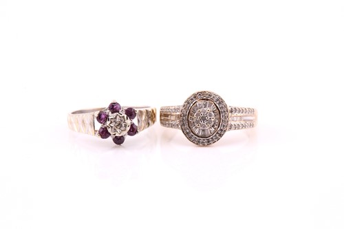 Lot 430 - A multi-diamond, oval cluster ring; the...