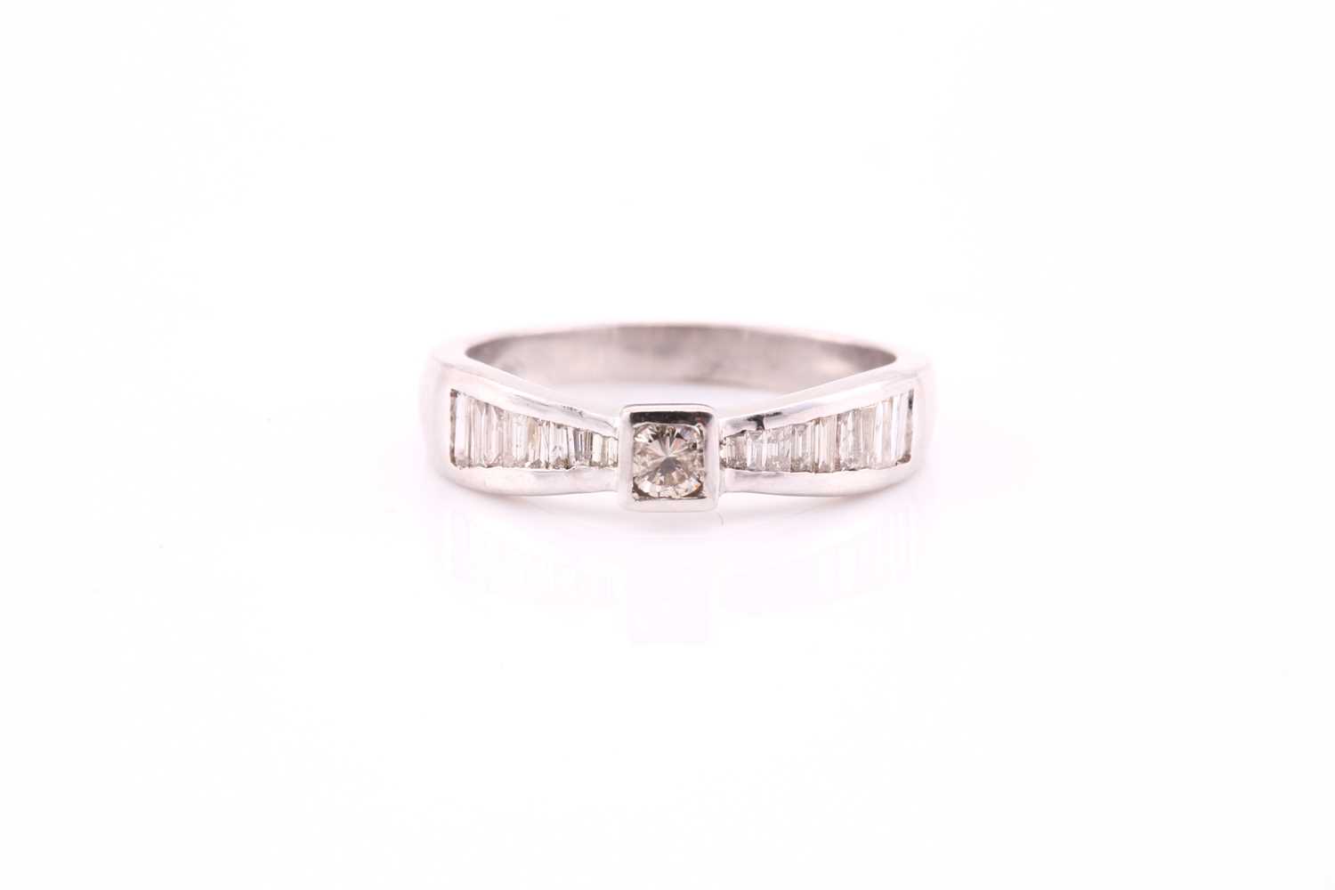 Lot 80 - A diamond ring, the central round brilliant...
