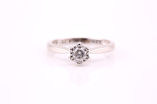 Lot 608 - A single stone diamond ring; the round...