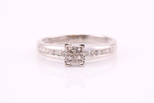 Lot 126 - A diamond cluster ring, the four princess cut...