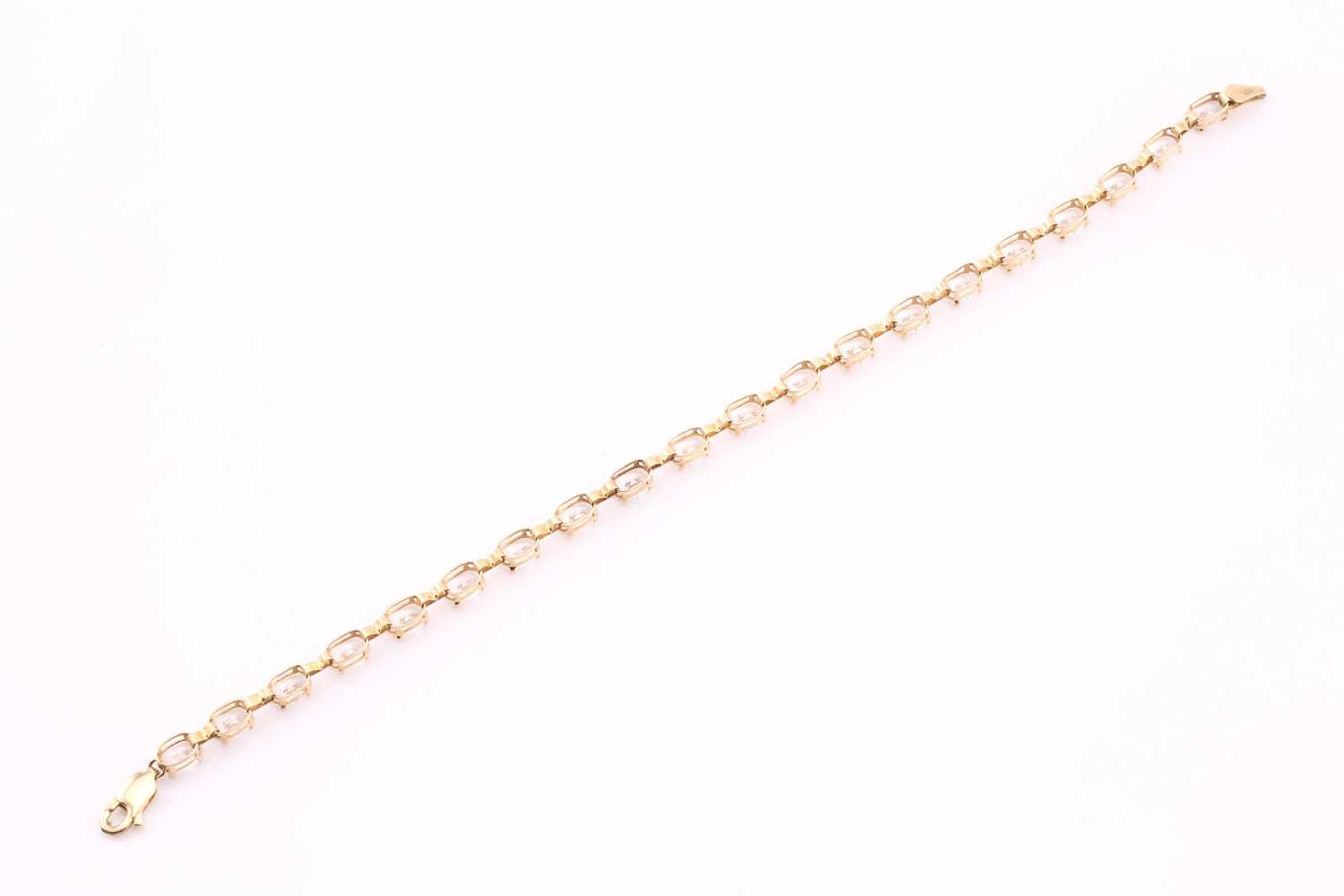 Lot 342 - A carat cubic zirconia tennis bracelet, the...