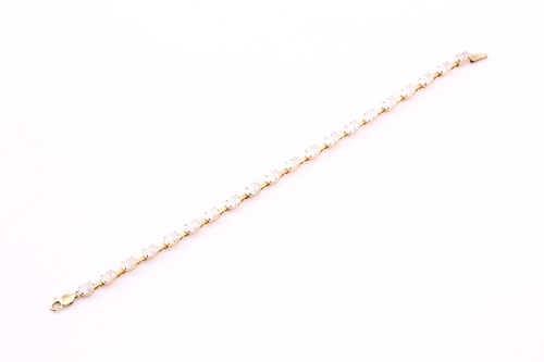 Lot 342 - A carat cubic zirconia tennis bracelet, the...