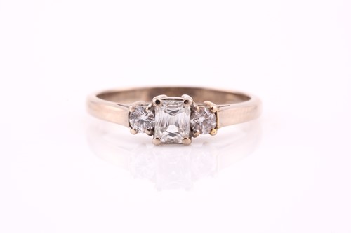 Lot 626 - A three stone half hoop diamond ring; the...