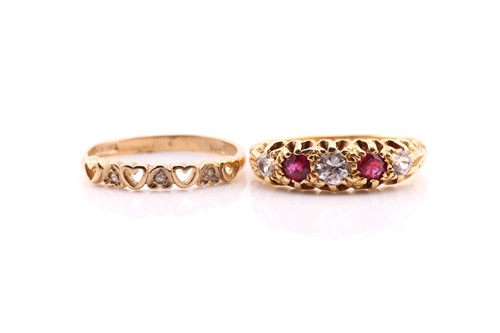 Lot 556 - A ruby and diamond half hoop ring; the...