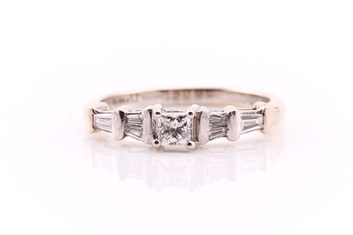 Lot 630 - A seven stone half hoop diamond ring;...