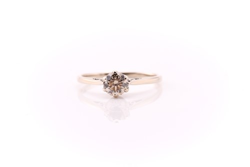 Lot 593 - A single stone diamond ring; the round...