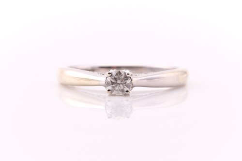 Lot 235 - A single stone diamond ring, the off-circular...