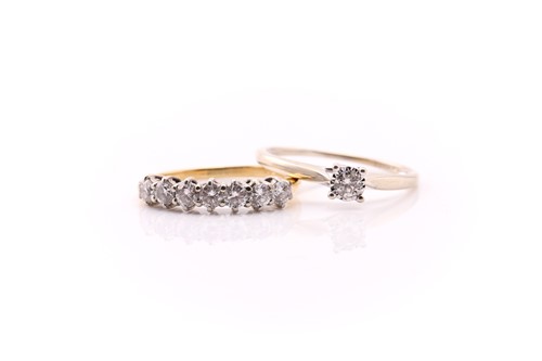 Lot 614 - A diamond seven stone half hoop ring; the...