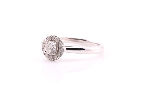 Lot 31 - A diamond cluster ring; the principal modified...
