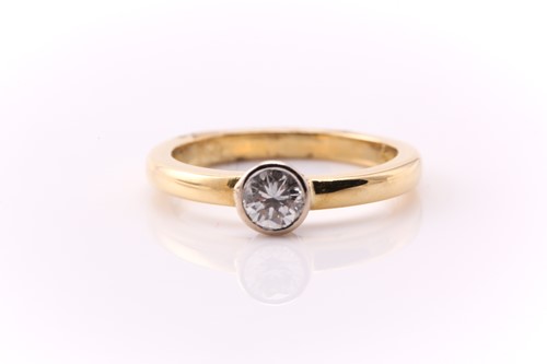 Lot 74 - A single stone diamond ring; the round...