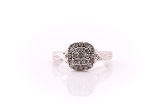 Lot 655 - A diamond cluster ring; the cushion-shaped...