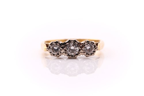 Lot 266 - A three stone diamond half hoop ring; the...