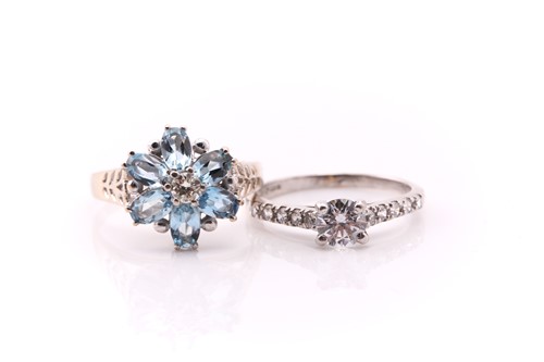 Lot 750 - An aquamarine and diamond flowerhead cluster...