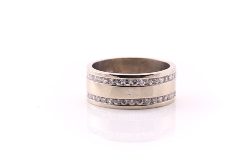 Lot 585 - A wide 9 carat white gold band; set with two...