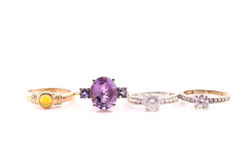 Lot 840 - A citrine and amethyst crossover ring in 9...